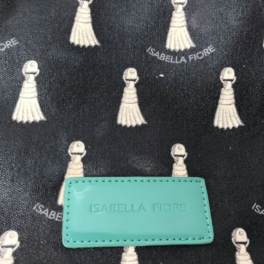 Isabella Fiore black and teal tassels make up bag